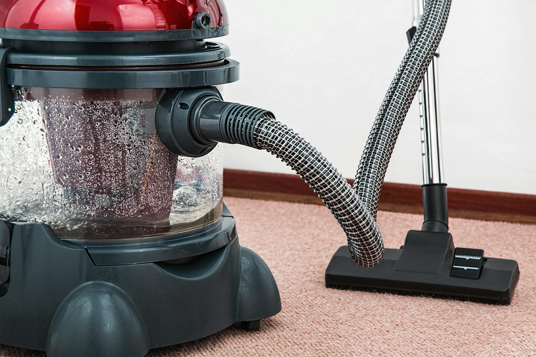 How to Choose the Perfect Vacuum Cleaner for Your Home 1 black and red canister vacuum cleaner on floor